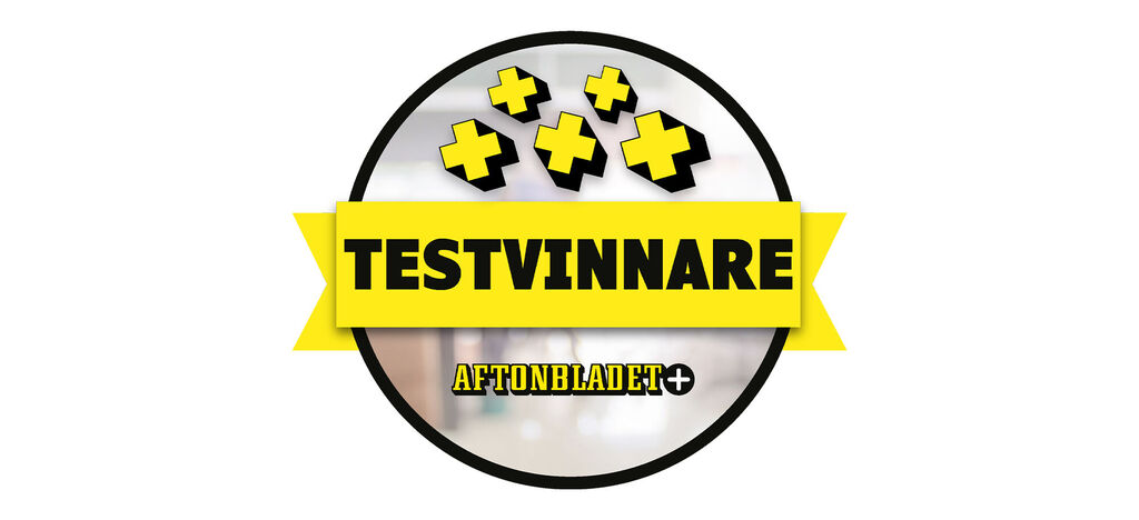 Logotyp med svart ram och gul text som visar 'TESTVINNARE', med ett plus i mitten