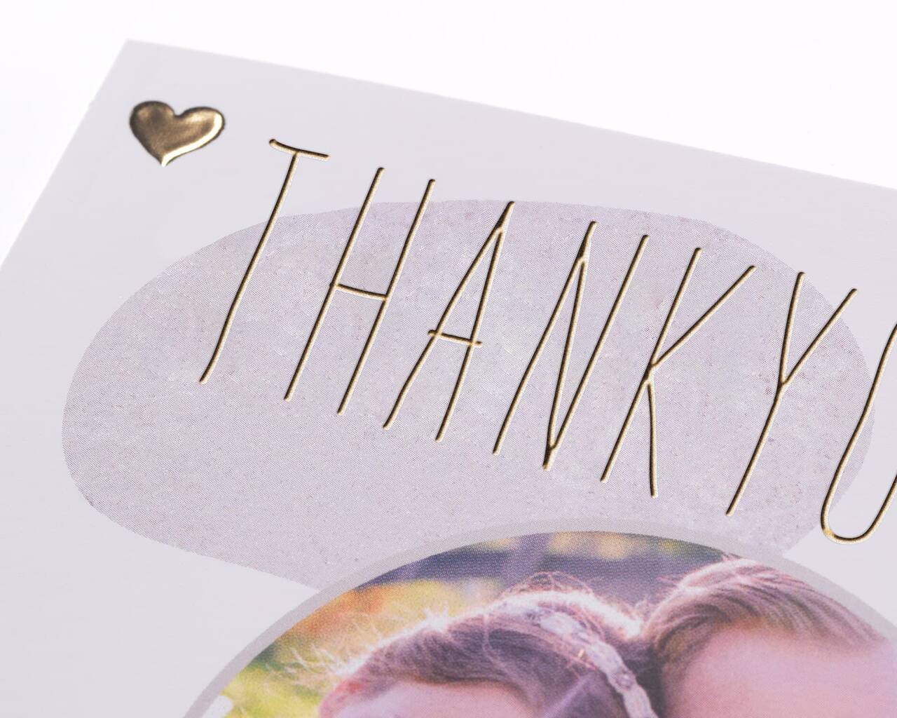 Grattiskort med texten 'THANK YOU' och ett hjärtsymbol